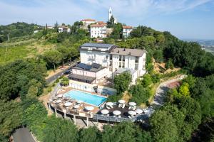 an aerial view of a house on a hill with a swimming pool at Albergo Centopini in Gemmano