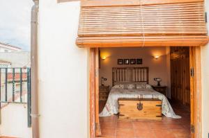 Cama o camas de una habitación en Casa Rural Rosa