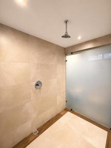 a room with a large white garage door at hotel 202 in Monterrey +18 photos