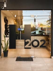 a store front door with a sign on it at hotel 202 in Monterrey
