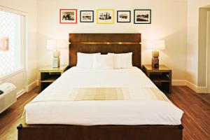 a bedroom with a large bed with two night stands at Casa Morada in Islamorada
