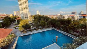 an overhead view of a swimming pool in a city at Beautiful Sea View Cozy Condo in Pattaya South
