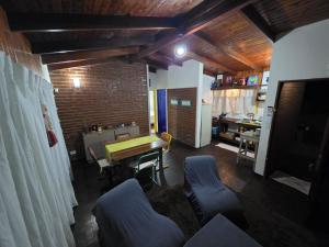 a living room with a ping pong table and chairs at El Refugio Misiones in Garupá