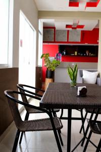 a dining room with a table and two chairs at Hotel Inkayacu in Paracas