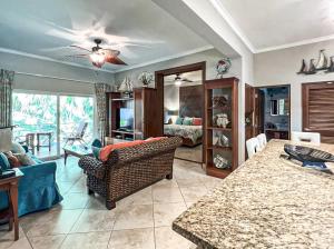 a living room with a couch and a table at Ocean One - Harmony! in Cabarete
