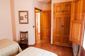 Cama o camas de una habitación en Casa Rural Rosa