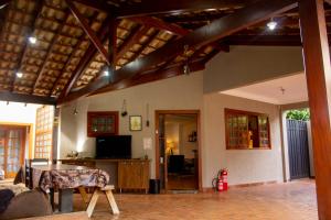 a living room with a couch and a table at Hostel Terraço Urbano in Sao Jose do Rio Preto