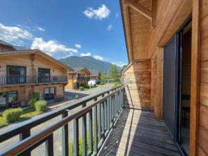 a balcony with a view of the mountains at Rattendorf 23A in Rattendorf