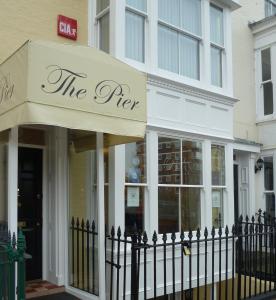 a store with an awning in front of a building at The Pier in Portsmouth