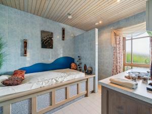 a bedroom with a large bed and a bath tub at Max in Waldkirchen