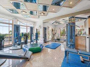 a gym with treadmills and exercise equipment at Hans in Waldkirchen