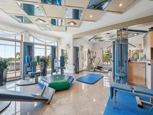 a gym with treadmills and exercise equipment at Traudi in Waldkirchen