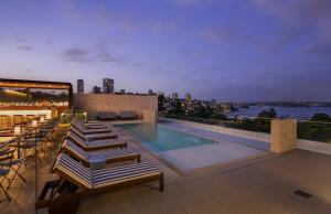a swimming pool on the roof of a building at InterContinental Sydney Double Bay by IHG in Sydney