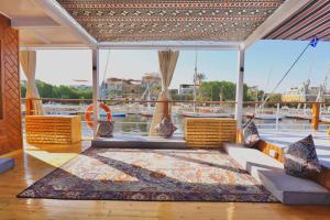 a living room with a view of a boat at Youssef Nile Boat in Luxor