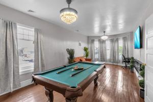 a living room with a pool table in it at 4BR Apt Pool Table Sleeps 9 Buffalo in Buffalo