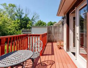 a patio with a table and chairs on a balcony at Unique Home - Upper Toronto Beaches in Toronto