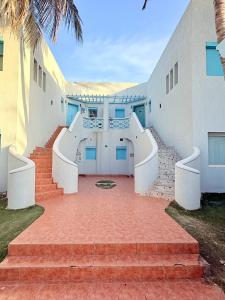 a set of stairs leading up to a building at شاليه درة العروس البرادايس بيتش in Dahaban