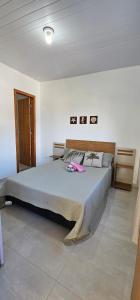 a bedroom with a large bed in a room at recanto Provetá 1 ILHA GRANDE in Praia de Provetá 