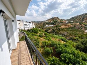 a balcony with a view of a mountain at Apartamento Torrox Village 2 in Torrox
