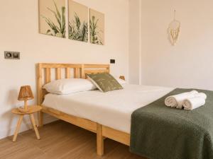 a bedroom with a bed with two towels on it at Apartamento Torrox Village 2 in Torrox