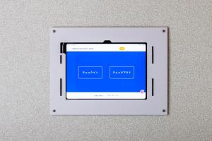 an electronic device is hanging on a wall at GRAND BASE Peace Park in Nagasaki