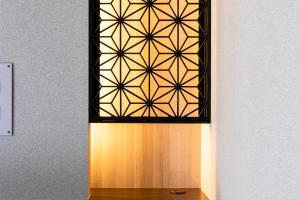 a stained glass window in a room with a table at GRAND BASE Peace Park in Nagasaki