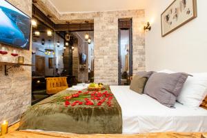 a bedroom with a bed with flowers on it at Countryside in Ulcinj +60 photos