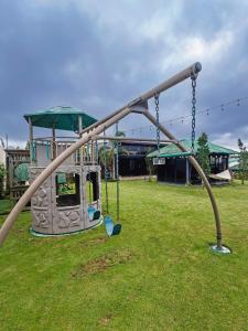 an empty swing set in a park at RMB's Downton Place in Tagaytay