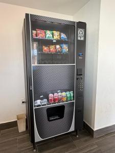 a vending machine with soda and drinks in it at Budget Inn in Vidalia