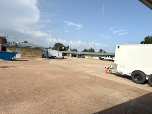 a white semi truck parked in a parking lot at Budget Inn in Vidalia +6 photos