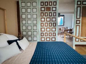 a person laying on a bed in a bedroom at El cuarto AZUL in Urrugne