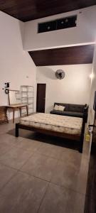 a bedroom with a bed in a room at Apartamento Beira do Valo in Iguape