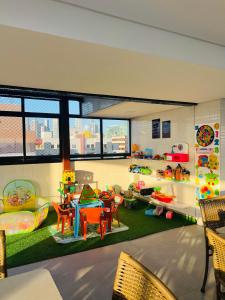 a room filled with lots of childrens furniture at Marinas Praia Flat 005 in João Pessoa