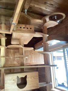 a room with wooden walls and a hat on the wall at 心のふれあい民泊 in Shimanto