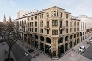 a large building on the corner of a street at Ruby Hanna Hotel Stuttgart by IHG in Stuttgart