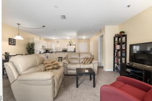 a living room with two couches and a tv at Condominium at Lakeside Golf & CC - unit 104 apts in Inverness
