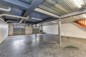 an empty garage with a large room with metal ceilings at Llewoh on Crofton in Echuca