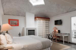 TV a/nebo společenská místnost v ubytování Hotel La Morada