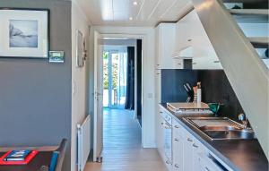 a kitchen with a sink and a counter top at Golf 3 in Middelkerke