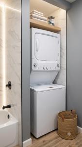 a bathroom with a toilet and a tv in a room at Stylish Studio in Oleander Close to Downtown in Bakersfield