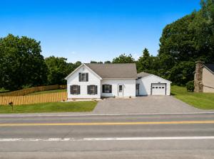 a white house on the side of a road at Riverview Bliss in Beautiful Home in Pulaski