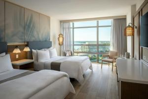 a hotel room with two beds and a large window at The Westin Tampa Bay in Tampa +64 photos