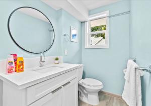 a bathroom with a white sink and a mirror at One Bed Honolulu Kaaha in Honolulu +14 photos