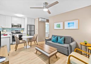 a living room with a couch and a table at One Bed Honolulu Kaaha in Honolulu