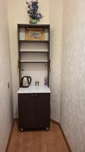 a room with a shelf with a white counter top at The Golden Street Hotel in Baku