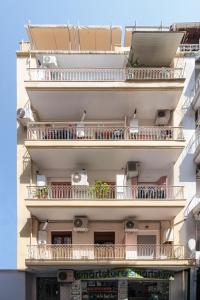a building with balconies on the side of it at Lumahaus Chamber Palaiologou in Thessaloniki