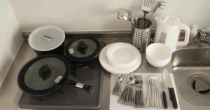 a kitchen counter with a sink and utensils at SCREEN Shibamata 20 mins to Skytree in Tokyo +47 photos