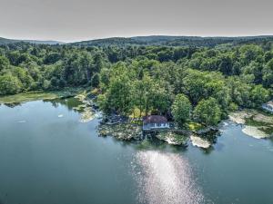an aerial view of a house on an island in a lake at Lakefront Couples Retreat in the Poconos in Saylorsburg