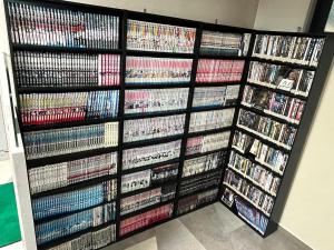a wall of video games and dvds at サンシティーホテル山代 in Kaga