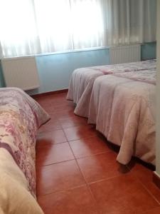 Posteľ alebo postele v izbe v ubytovaní Hostal Campus